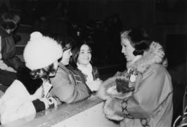 Iona Campagnolo talks with three unidentified teenage girls in the Cassiar arena