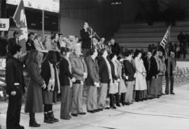 Jan Kapicky from Cassiar with a group of people lined up in front of a stage in an arena with man...