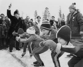 Pierre Trudeau fires a starting pistol at a children's speed skating event during the 1978 Northern BC Winter Games