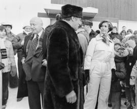 Iona Campagnolo, Pierre Trudeau and Ron Basford talk with a crowd at a children's speed skating event