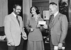 Iona Campagnolo and Cyril Shelford accept a cheque from the Minister of Finance