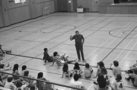 Gym teacher speaks to physical education students at Mount Elizabeth Secondary School