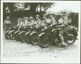 Seven members of No. 1 Canadian Provost Corps in motorcycle formation