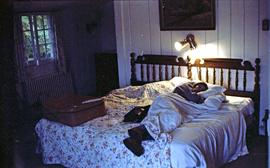 Unidentified woman sleeping on bed in Lake Placid, NY