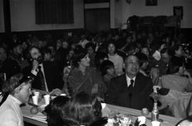 Iona Campagnolo, Earl Mah, and others sit at a table during a Chinese New Year event