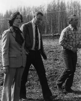Iona Campagnolo stops in a cow pasture with Minister Jack Horner and unidentified man
