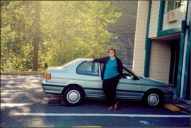Bridget Moran Standing Beside Car