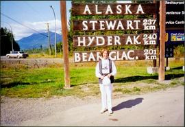 Unidentified Woman at Alaska Signage