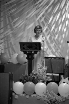 Woman speaking at Queen Charlotte Secondary School graduation ceremony