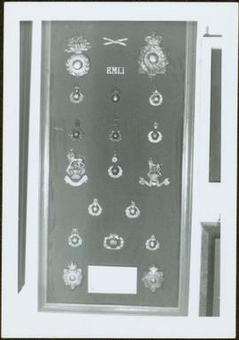 Framed collection of Royal Marine Light Infantry badges