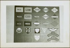 Framed collection of military badges