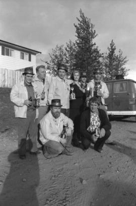 Winning team of the Kitimat Delta King Days raft rce pose for group portrait with Iona Campagnolo
