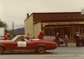 Iona Campagnolo pointing to crowd while atop convertible in Prince Rupert Sea Festival parade