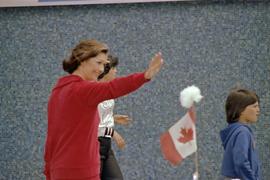 Iona Campagnolo waving while walking in the Kitimat Captain Cook Bicentenary parade