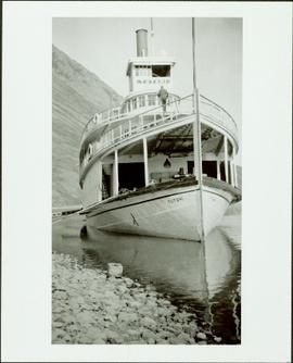 Steamship Tutshi at dock along a rocky shore