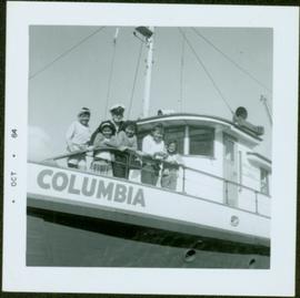 Ship Captain and five First Nations children on the deck of the M.S. Columbia