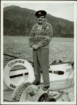 James Joseph Claxton wearing Cowichan sweater standing on the deck of the M.S. Columbia