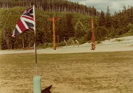 Totem poles and Union Jack at opening of Haisla Recreation Centre in Kitamaat Village