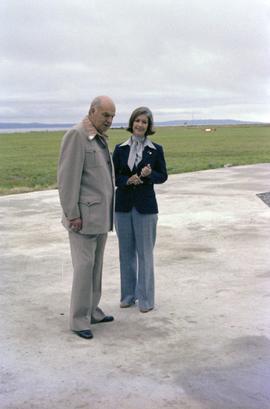 Iona Campagnolo and Cliff McGinnis on helicopter pad at opening of Queen Charlotte helicopters in Sandspit