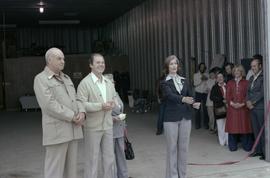 Iona Campagnolo and Cliff McGinnis with man and woman at opening ceremony for Queen Charlotte Helicopters in Sandspit