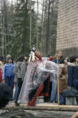 First Nations people wearing button blanket at raising of Unity Totem Pole in New Aiyansh