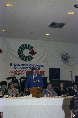 Man at microphone at the kick-off for the 1979 Canada Winter Games in Brandon Manitoba