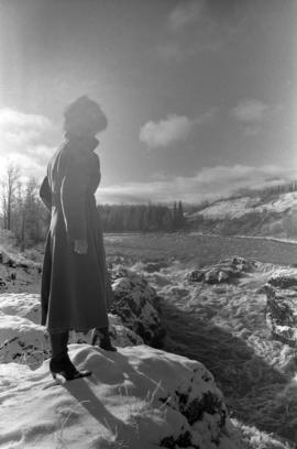 Iona Campagnolo with flooded Bulkley River near Moricetown in background