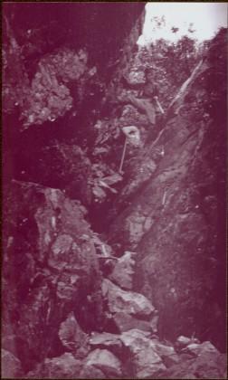 Taku River Survey - Men climbing down rocks