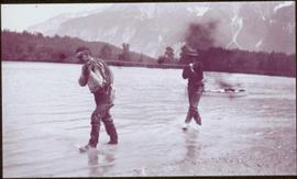 Taku River Survey - Two Men Walking in Kopoka River
