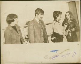 Unidentified man and woman stand next to Iona Campagnolo and Teresa Wright