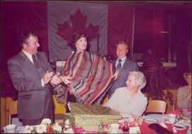 M.P. Iona Campagnolo receives gift at a reception in Jeanne Sauvé’s riding, Ahuntsic, late 1974