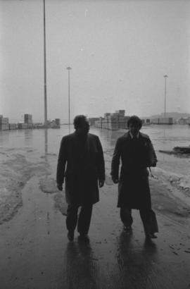 Otto Lang and man walking on Fairview Cargo Terminal in Prince Rupert