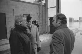Otto Lang speaking with two unknown men during his visit to Fairview Cargo Terminal in Prince Rupert