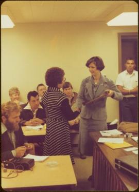 Minister Iona Campagnolo presents a memorial plaque to Mrs. Nathan Barton at a Northwest Corridor Development Corporation meeting, Prince Rupert, BC
