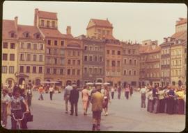 Iona Campagnolo walking into Old Town Market Square, Warsaw, Poland -