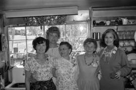 Iona Campagnolo with women at Bill Campbell's home in Smithers