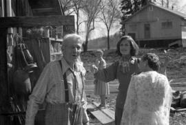 Iona Campagnolo with Bill Campbell and women at his home in Smithers