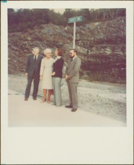 Minister Iona Campagnolo standing with unidentified woman and two unidentified men in front of sign reading: “Scott Rd”