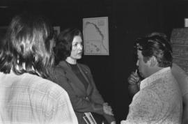 Iona Campagnolo talking to men at a road design meeting