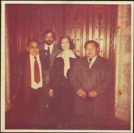 Minister Iona Campagnolo posing with three unidentified Nisga’a chiefs in unknown room