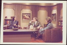 Iona Campagnolo sits with unidentified man and woman around coffee table in CBC television studio