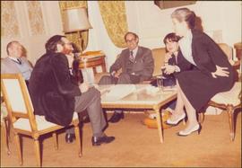 Paris Press Conference - Iona Campagnolo, Roger Jackson, two unidentified men, and an unidentified woman sit talking around a coffee table