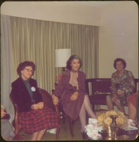 Iona Campagnolo sitting in living room with unidentified woman and Thérèse Casgrain, Quebecois feminist and former senator
