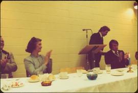 Iona Campagnolo clapping at head table as speaker steps away from the podium, Sportsman's Dinner, Fultonvale Fastball Club, February 1981