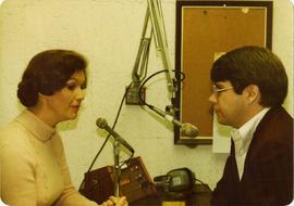 Iona Campagnolo at radio interview with unknown man