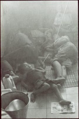 CUSO Mission, North-eastern Thailand - Unidentified family sleeps on a floor