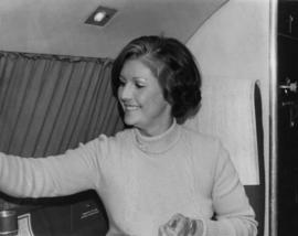 Iona Campagnolo seated in an airplane