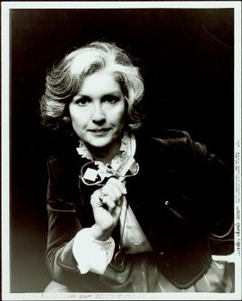 Campaign portrait of Iona Campagnolo holding a pair of glasses, October 1982
