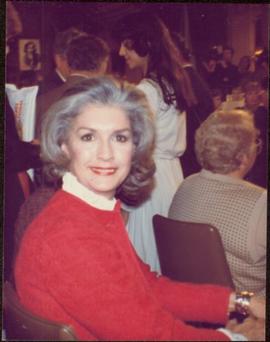 Close view of Iona Campagnolo sitting in a crowded hall during presidency campaign, November 1982
