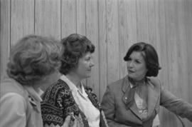 Iona Campagnolo speaking with women